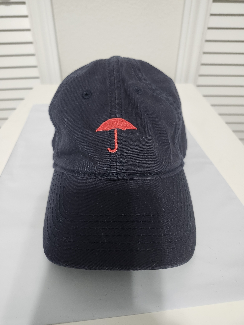 Legacy Navy Baseball Cap with Red Umbrella Embroidery